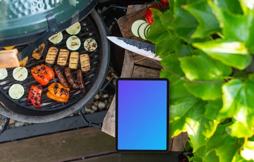 iPad mockup with grilled vegetables next to it