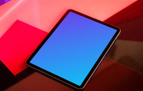 iPad mockup with red background