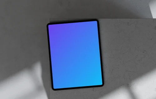 iPad Pro mockup on marble surface with shadows