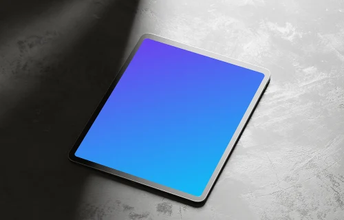 iPad Pro mockup on textured rock surface with dramatic shadows