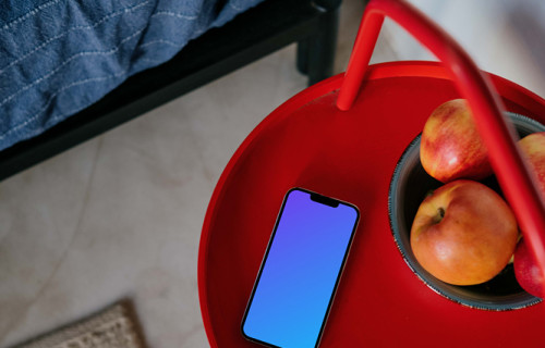  iPhone 13 Pro mockup placed next to a fruit bowl