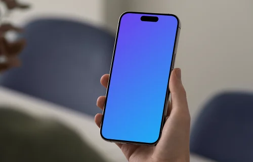 iPhone 15 Pro mockup in hand against blurred background