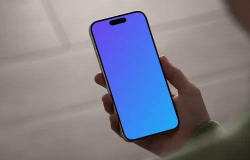 iPhone 15 Pro mockup in hand with neutral background