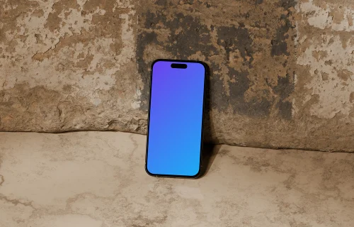 iPhone 16 mockup against rugged stone wall