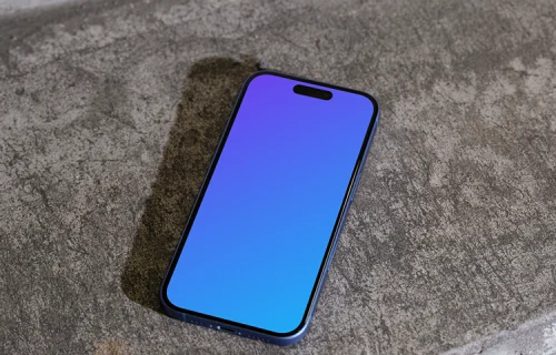 iPhone 16 mockup on a concrete surface