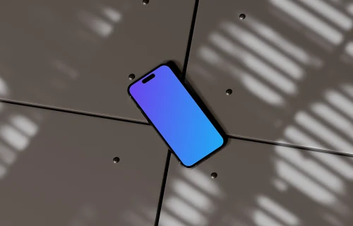 iPhone 16 mockup on a geometric surface