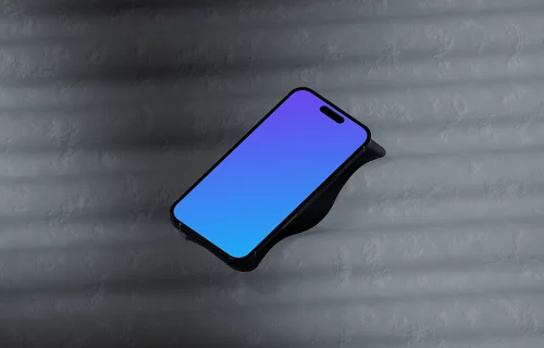 iPhone 16 mockup on a textured surface