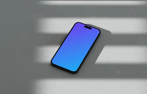 iPhone 16 mockup on marble with shadows and natural light