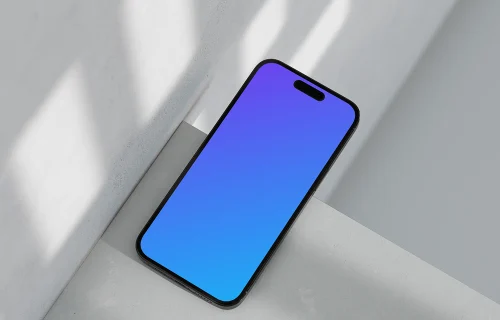 iPhone 16 mockup on marble with shadows