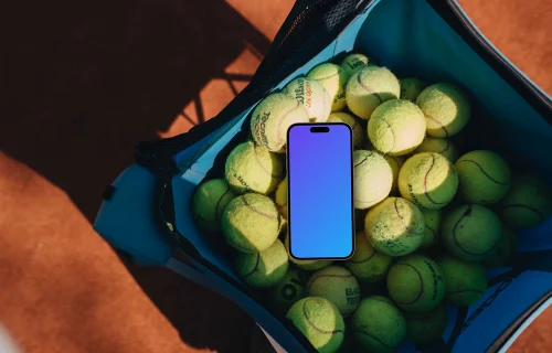 iPhone mockup in a bag full of tennis balls