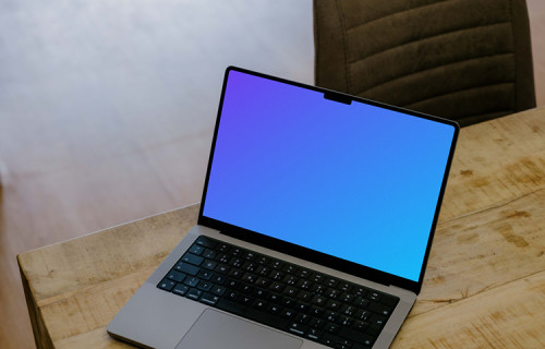 Laptop mockup on the wooden table