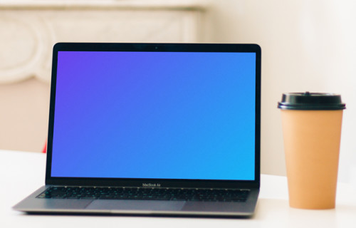 MacBook Air mockup beside a cup of coffee