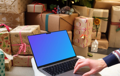 MacBook mockup next to the Christmas tree and gifts