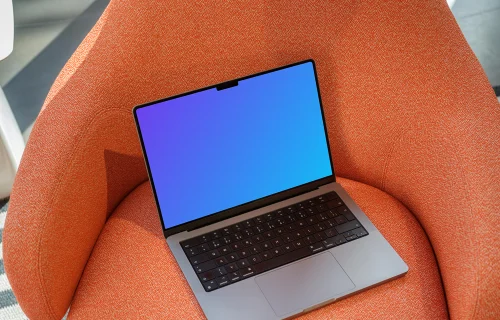 MacBook Pro Mockup on an Orange Textured Armchair