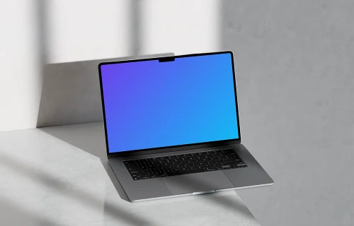 MacBook Pro mockup on marble surface with shadows