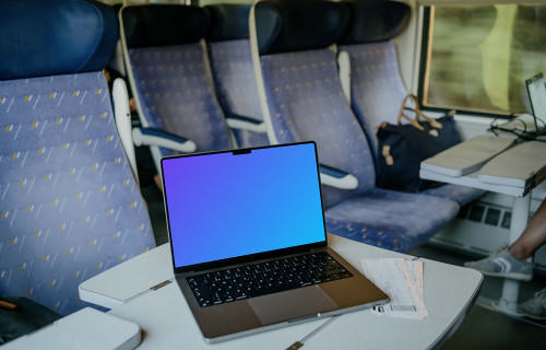 MacBook Pro mockup on train table