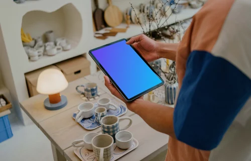 Male hands holding a tablet mockup