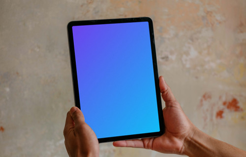 Male hands holding iPad Air mockup