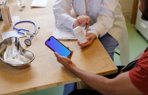 Male patient holding the iPhone mockup