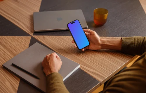 Man holding a iPhone mockup in the office environment