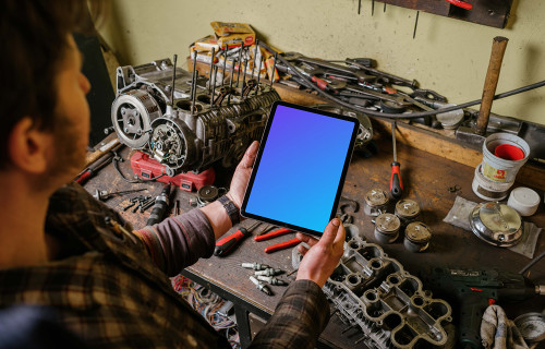 Man holding an iPad Air mockup