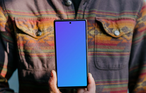 Man holding up a Pixel 6 mockup