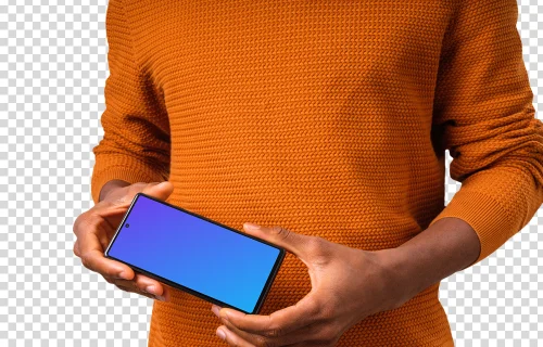 Man in orange sweater holding Google Pixel mockup in landscape