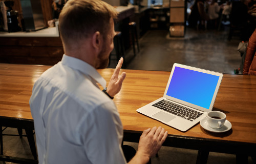 Man working on the MacBook Pro in coworking space