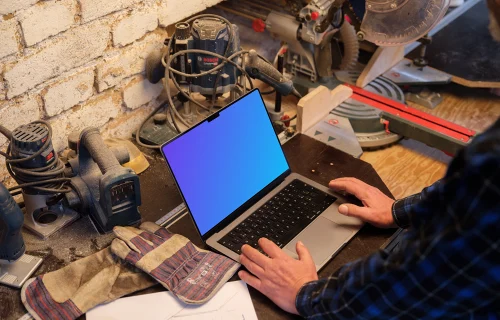 Mechanic working on a MacBook Pro mockup