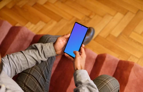 Office setting and man holding a Google Pixel mockup