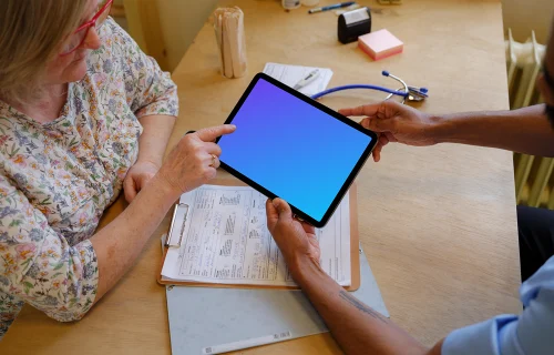 Patient and the doctor with a tablet mockup