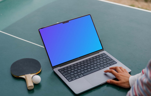 Ping-pong player checking on a MacBook Pro mockup