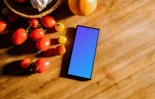 Pixel 6 mockup on a table next to fruits