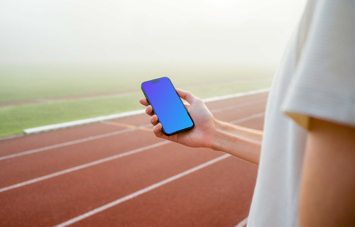 Runner holding an iPhone mockup