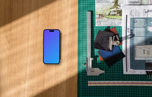 Smartphone mockup on architect's desk