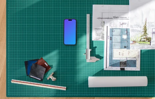 Smartphone mockup on architect's planning table