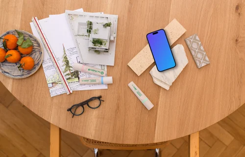 Smartphone mockup with architect's blueprint and tools