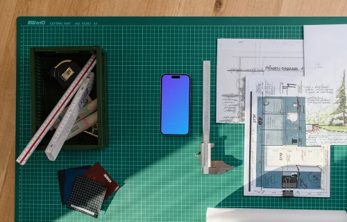 Smartphone mockup with architectural plans and tools