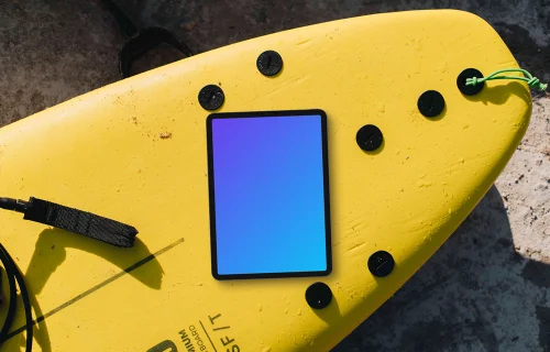Surfboard with the tablet mockup on top of it