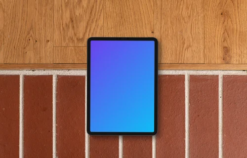 Tablet mockup against brick and wood backdrop
