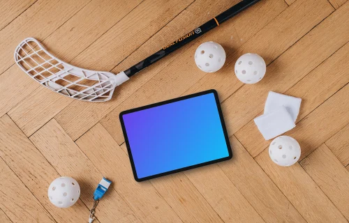 Tablet mockup next to the floorball stick