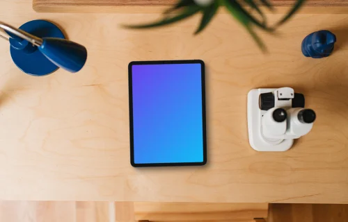 Tablet mockup on a child-friendly desk with educational tools