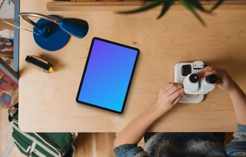 Tablet mockup on child's creative workspace