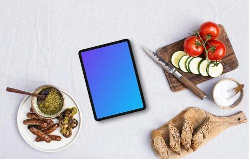 Tablet mockup surrounded by barbecue essentials