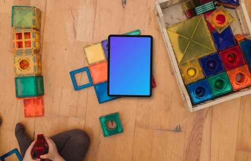 Tablet mockup surrounded by colorful building blocks