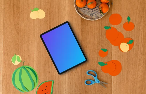 Tablet mockup surrounded by colorful paper fruit cutouts
