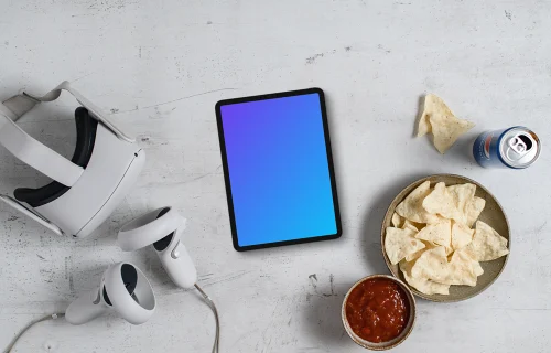 Tablet mockup with VR gaming setup and snacks