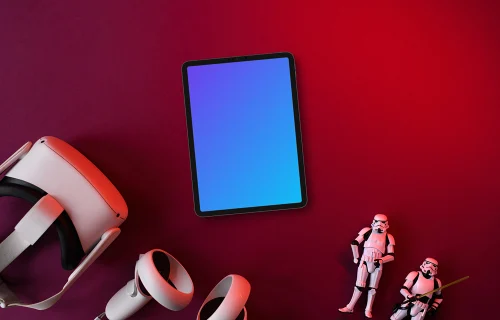 Tablet mockup with VR headset and action figures on burgundy backdrop