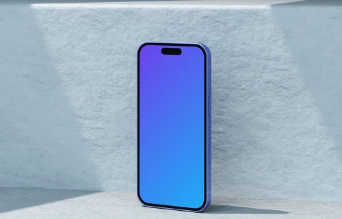 Ultramarine iPhone 16 mockup standing against a textured wall