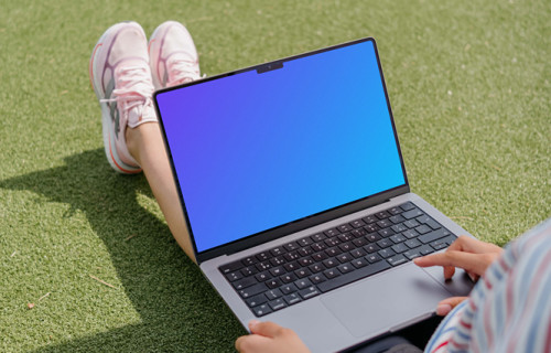 Woman hand scrolling on a MacBook Pro 14 mockup